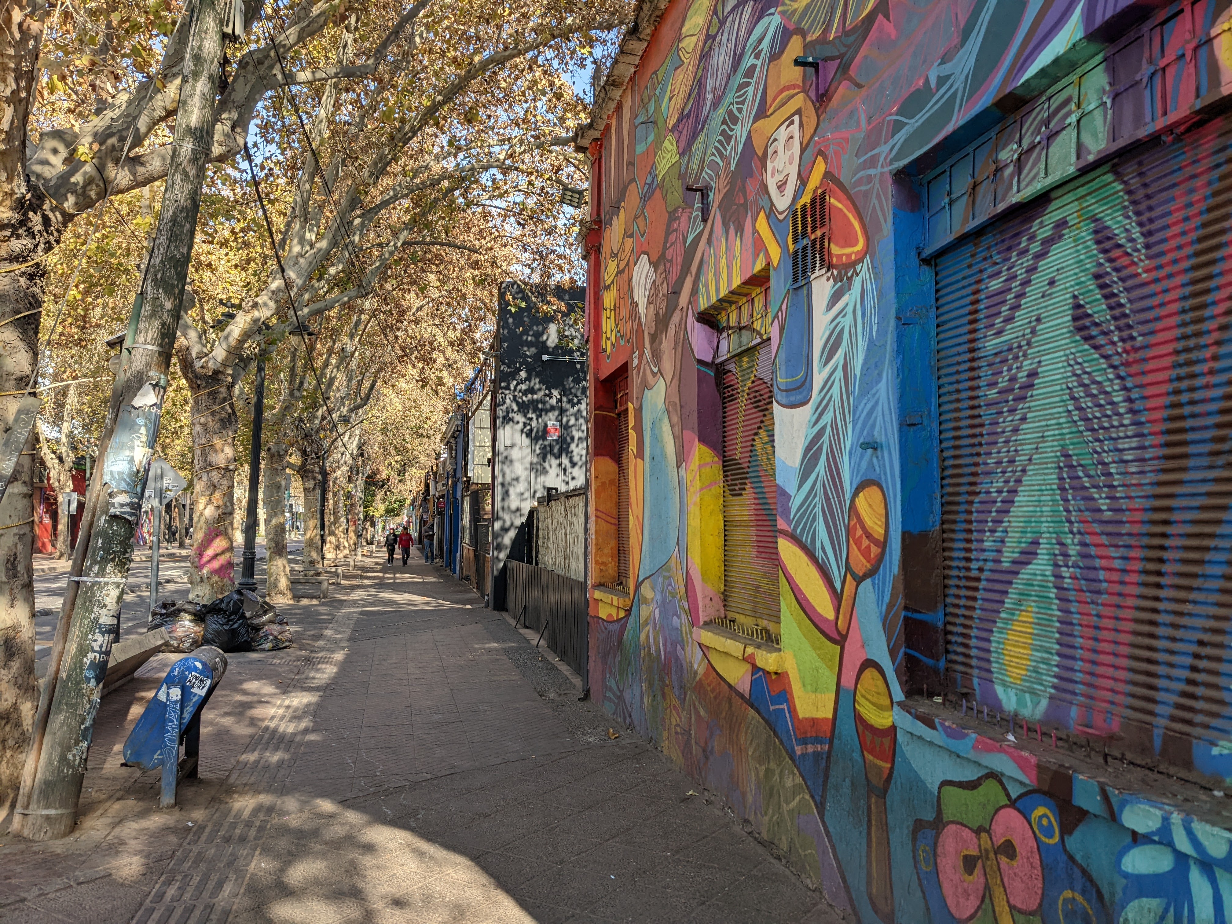 mural and tree lined street